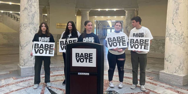 Supporters of BABE Vote, a student activist group, gathered at the Idaho Capitol, announcing a lawsuit to fight a new law that bans students from using student IDs to vote, on Friday, March 17, 2023, in Boise, Idaho. (Mia Maldonado/Idaho Statesman/Tribune News Service via Getty Images)