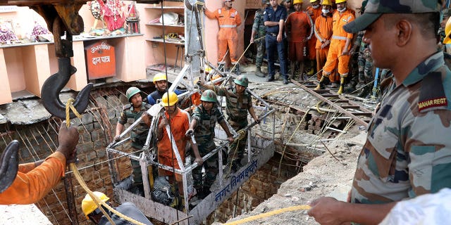 36 bodies found inside a well at an Indian temple following a devastating collapse 36 bodies found inside a well at an Indian temple following a devastating collapse