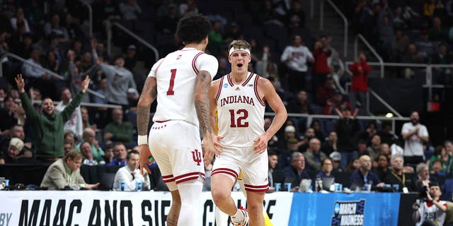 Miller Cobb #12 of the Indiana Hoosiers responds after a basket in the second half against the Kent State Golden Flashes during the first round of the NCAA Men's Basketball Tournament at MVP Arena on March 17, 2023 in Albany, New York. 