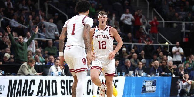 Miller Kopp #12 of the Indiana Hoosiers reacts after a basket in the second half against the Kent State Golden Flashes during the first round of the NCAA Men's Basketball Tournament at MVP Arena on March 17, 2023 in Albany, New York.