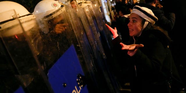 Turkish women protesting a ban on International Women's Day marches stared down police donning riot gear in Istanbul.