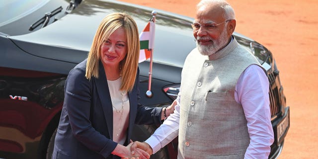 Italian Premier Giorgia Meloni, left, is received by Indian Prime Minister Narendra Modi at the Indian Presidential Palace in New Delhi on March 2, 2023.