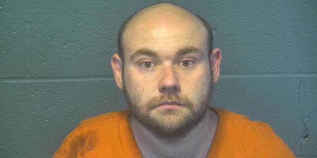 Jake Harris, 31, allegedly killed his girlfriend in his Oklahoma City home and stayed with her body for "several days," according to police.