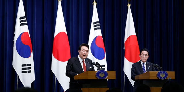 <strong>South Korean President Yoon Suk Yeol, left, and Japanese Prime Minister Fumio Kishida, right, speak at their bilateral meeting in Tokyo, Japan, on March 16, 2023. Japan and South Korea met to strengthen their alliance against threats from China and North Korea.</strong>