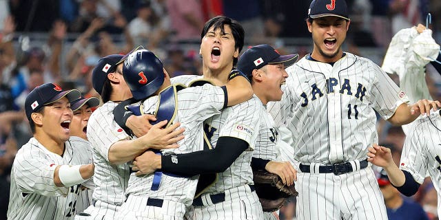 Team Japan celebrates after the final out of the World Baseball Classic Championship defeating Team USA 3-2 at loanDepot park on March 21, 2023, in Miami, Florida.