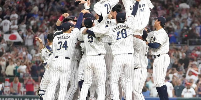 Team Japan celebrates after the final out of the World Baseball Classic Championship defeating Team USA 3-2 at loanDepot park on March 21, 2023, in Miami, Florida. 