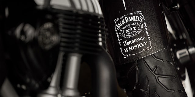 The whiskey brand is prominently displayed on the fenders.