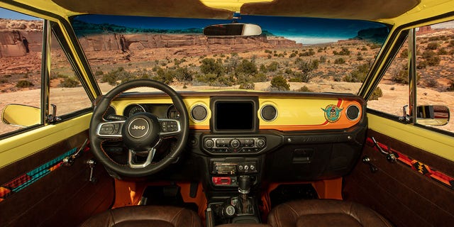 Jeep equipped the Cherokee 4xe Concept with an 8-track player and "stash" box.