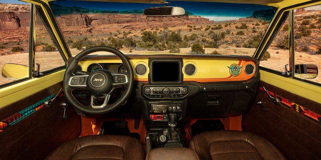 Jeep equipped the Cherokee 4xe Concept with an 8-track player and "stash" box.
