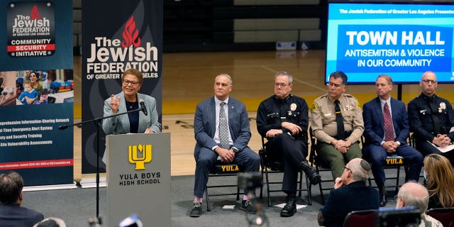 Los Angeles Mayor Karen Bass, at podium, addresses antisemitic violence on Feb. 20, 2023, at an event following recent shootings targeting Jewish community members.