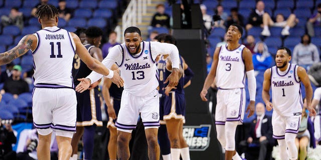  Desi Sills #13 of the Kansas State Wildcats celebrates with teammates during the second half against the Montana State Bobcats in the first round of the NCAA Men's Basketball Tournament at The Fieldhouse at Greensboro Coliseum on March 17, 2023 in Greensboro, North Carolina. 