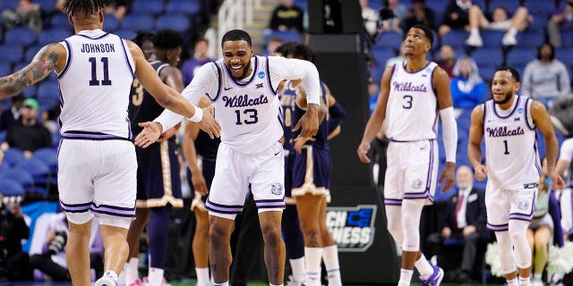  Desi Sills #13 of the Kansas State Wildcats celebrates with teammates during the second half against the Montana State Bobcats in the first round of the NCAA Men's Basketball Tournament at The Fieldhouse at Greensboro Coliseum on March 17, 2023 in Greensboro, North Carolina. 