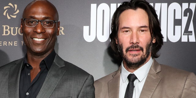 Lance Reddick, left, starred in all four "John Wick" films alongside Keanu Reeves.