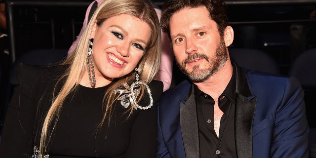 Kelly Clarkson and Brandon Blackstock smile in happier times.