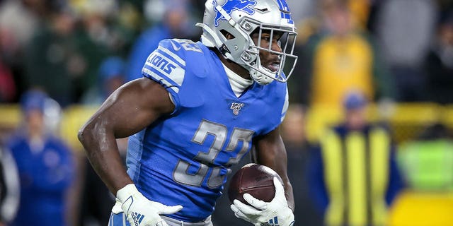 Kerryon Johnson, #33 of the Detroit Lions, runs with the ball in the second quarter against the Green Bay Packers at Lambeau Field on October 14, 2019 in Green Bay, Wisconsin.
