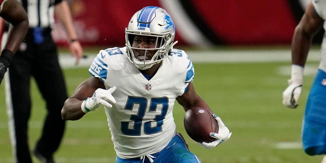 Kerryon Johnson, #33 of the Detroit Lions, runs with the ball during an NFL football game against the Arizona Cardinals on Sept. 27, 2020 in Glendale, Arizona.
