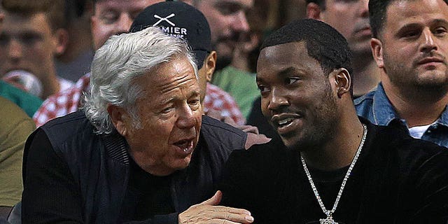 New England Patriots owner Robert Kraft chats with rapper Meek Mill in their courtside seats.  The Boston Celtics hosted the Philadelphia 76ers in the second game of their NBA Eastern Conference semifinal playoff series at TD Garden in Boston on May 3, 2018. 