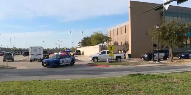 Lamar High School in Arlington, Texas, was put on lockdown early Monday after a shooting was reported outside the school building, police said.