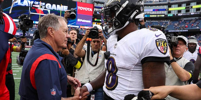 Head coach Bill Belichick of the New England Patriots shakes hands with quarterback Lamar Jackson #8 of the Baltimore Ravens after Baltimore's 37-26 win at Gillette Stadium on September 25, 2022 in Foxborough, Massachusetts. 