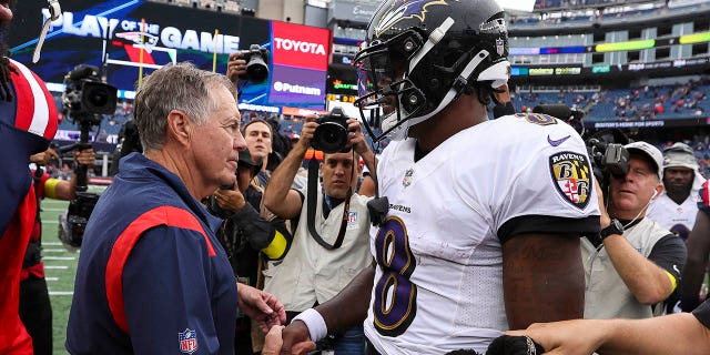 Head coach Bill Belichick of the New England Patriots shakes hands with quarterback Lamar Jackson #8 of the Baltimore Ravens after Baltimore's 37-26 win at Gillette Stadium on September 25, 2022 in Foxborough, Massachusetts.