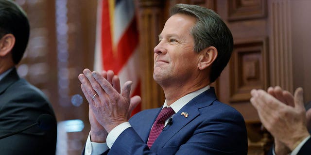 Georgia Gov. Brian Kemp applauds on the House floor of the state Capitol, on Jan. 25, 2023, in Atlanta. The state Senate voted on March 7, 2023, to pass a bill that would allow some pregnant women to apply for cash aid, a proposal that Kemp backed.