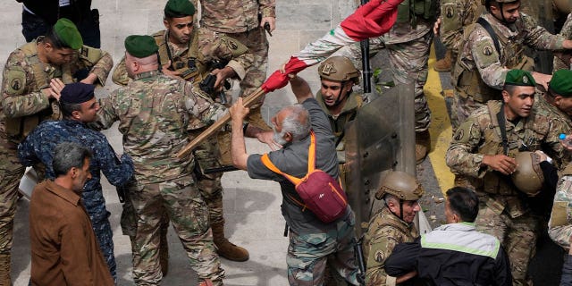 Retired army soldiers and other protesters demanding better pay clash with the Lebanese army in Beirut, Lebanon, on March 22, 2023.