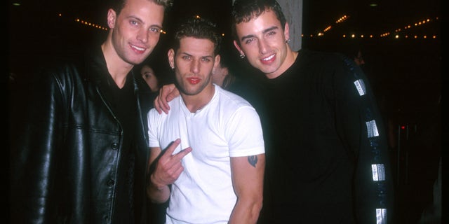 Devin Lima, center, replaced Gillis in 1999.