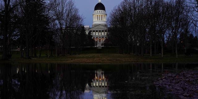 Democratic Maine Gov. Janet Mills has signed a two-year fund into law, averting a imaginable shutdown by Republicans successful Augusta.