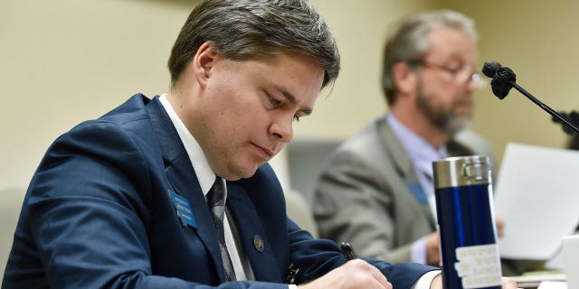 Rep. Jeremy Trebas takes notes during a gathering successful Helena, Montana, connected Jan. 14, 2021. Trebas is sponsoring authorities that would artifact diverseness training for authorities employees.