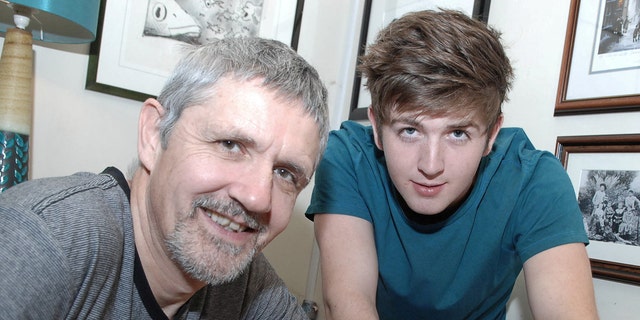 Ian McLeod (left) with his son Cory McLeod, who was 21 in this picture. The father said he hoped the years of photos would "benefit Cory in some way," as SWNS reported.