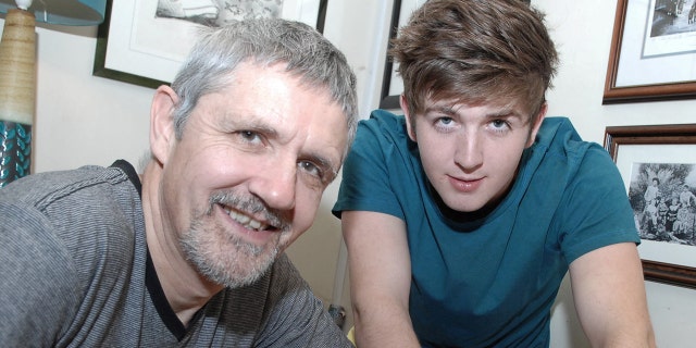 Ian McLeod (left) with his son Cory McLeod, who was 21 in this picture. The father said he hoped the years of photos would "benefit Cory in some way," as SWNS reported.