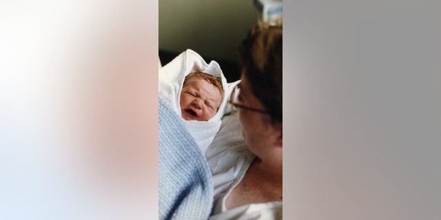 Cory McLeod photographed at one day old (in 1991) — the beginning of decades of picture-taking that charted one young man's life.