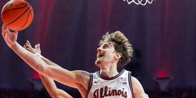 Matthew Mayer, #24 of the Illinois Fighting Illini, reaches for the ball during the game against the Indiana Hoosiers at the State Farm Center on January 19, 2023 in Champaign, Illinois. 