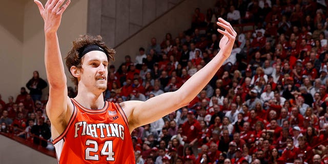 Illinois Fighting Illini forward Matthew Mayer, #24, celebrates during a college basketball game against the Indiana Hoosiers on Feb. 18, 2023 at Assembly Hall in Bloomington, Indiana. 