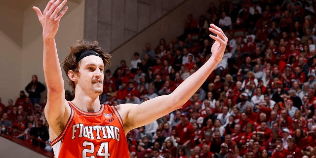 Illinois Fighting Illini forward Matthew Mayer, #24, celebrates during a college basketball game against the Indiana Hoosiers on February 18, 2023 at Assembly Hall in Bloomington, Indiana. 