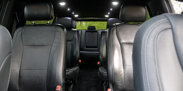 Seating includes two rows of captain's chairs and a third row bench seat.