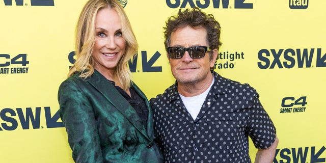 Michael J. Fox with his arm around Tracy Pollan