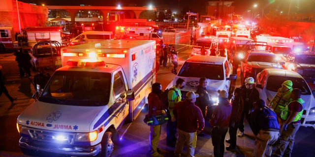 Ambulances, firefighters and vans from the morgue could be seen responding to the fire at a migrant detention facility in Ciudad Juarez, Mexico. 