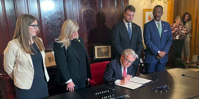 Republican Ohio Gov. Mike DeWine connected Friday signed a astir $13.5 cardinal proscription fund touting caller obstruction information measures into law.