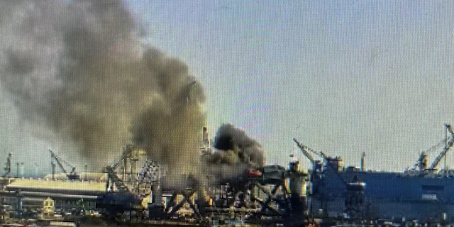 A ‘multi-story, oil rig-like structure’ caught fire along the Mobile River on Wednesday afternoon.