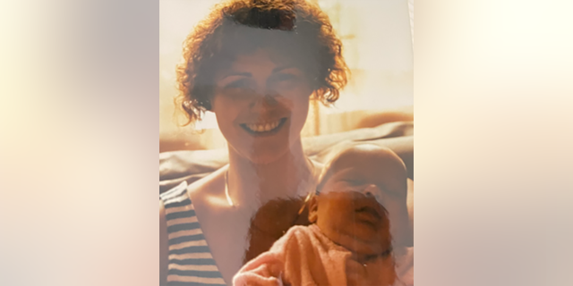Christine Belusko with her infant daughter born in 1989. 