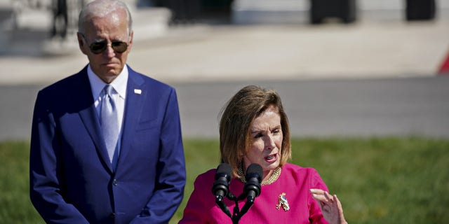 Former House Speaker Rep. Nancy Pelosi, D-Calif., speaks with President Biden listening behind her on Aug. 9, 2022. Pelosi spoke at a University of Chicago event on Friday, where she complained that Biden did not give House Democrats a "heads up" that he would sign legislation overturning Washington, D.C.'s revised criminal code. 