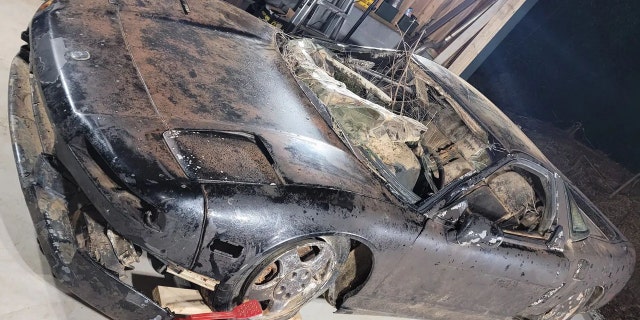 The car is being prepped for repairs at the Helix Auto Works shop.