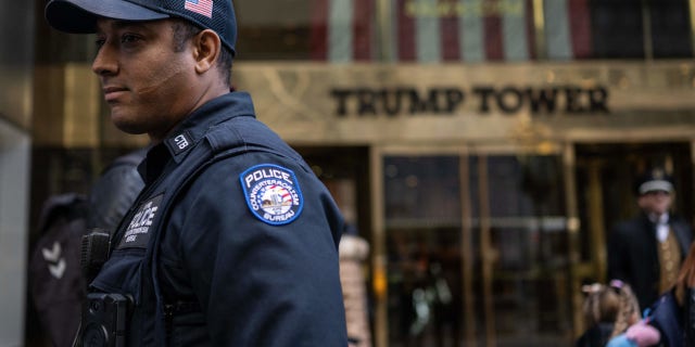 A police officer stands in front of Trump Tower in New York, New York on March 22, 2023. -