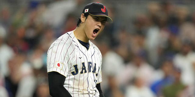 Shohei Ohtani #16 of Team Japan reacts to a double play in the ninth inning against  during the World Baseball Classic Championship at loanDepot park on March 21, 2023, in Miami, Florida. 