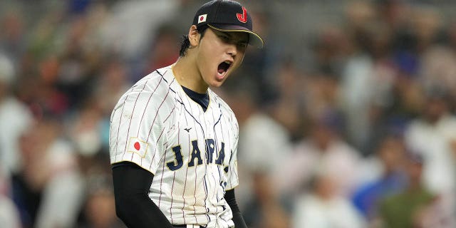 Shohei Ohtani #16 of Team Japan reacts to a double play in the ninth inning against  during the World Baseball Classic Championship at loanDepot park on March 21, 2023, in Miami, Florida. 