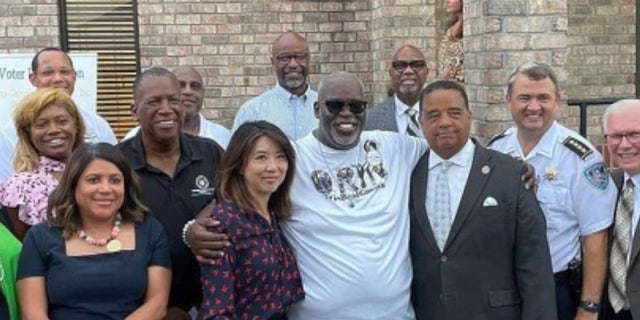 Grant hosts a rally with local officials, law enforcement and other community members to tackle the city's crime surge after losing his son to gun violence. 