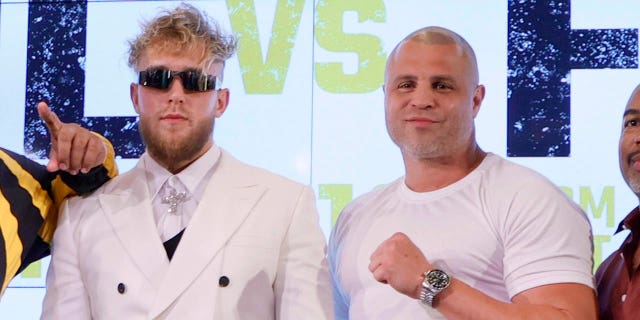 Jake Paul and boxer Benjamin "BJ" Flores pose during a news conference to promote Showtime pay-per-view boxing event between Jake Paul and Tommy Fury at Resorts World Las Vegas on November 6, 2021, in Las Vegas, Nevada. Paul will face Fury in an eight-round cruiserweight bout, at a 192-pound catchweight, at Amalie Arena in Tampa, Florida on December 18.