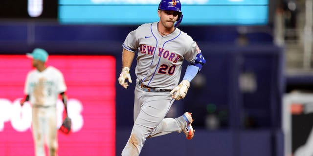 Pete Alonso of the New York Mets walks the bases after hitting a home run against the Miami Marlins during the ninth inning at LoanDepot Park on March 31, 2023 in Miami, Florida.