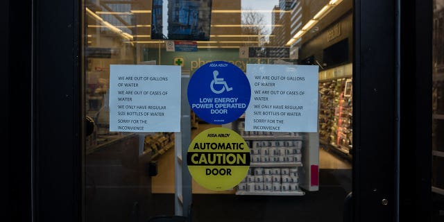 A sign on the front door of a Walgreens in Center City located in Philadelphia March 26, 2023. Water in Philadelphia has been deemed unsafe to drink following a chemical spill in the Delaware River, leading to water bottles being sold out across the city.
